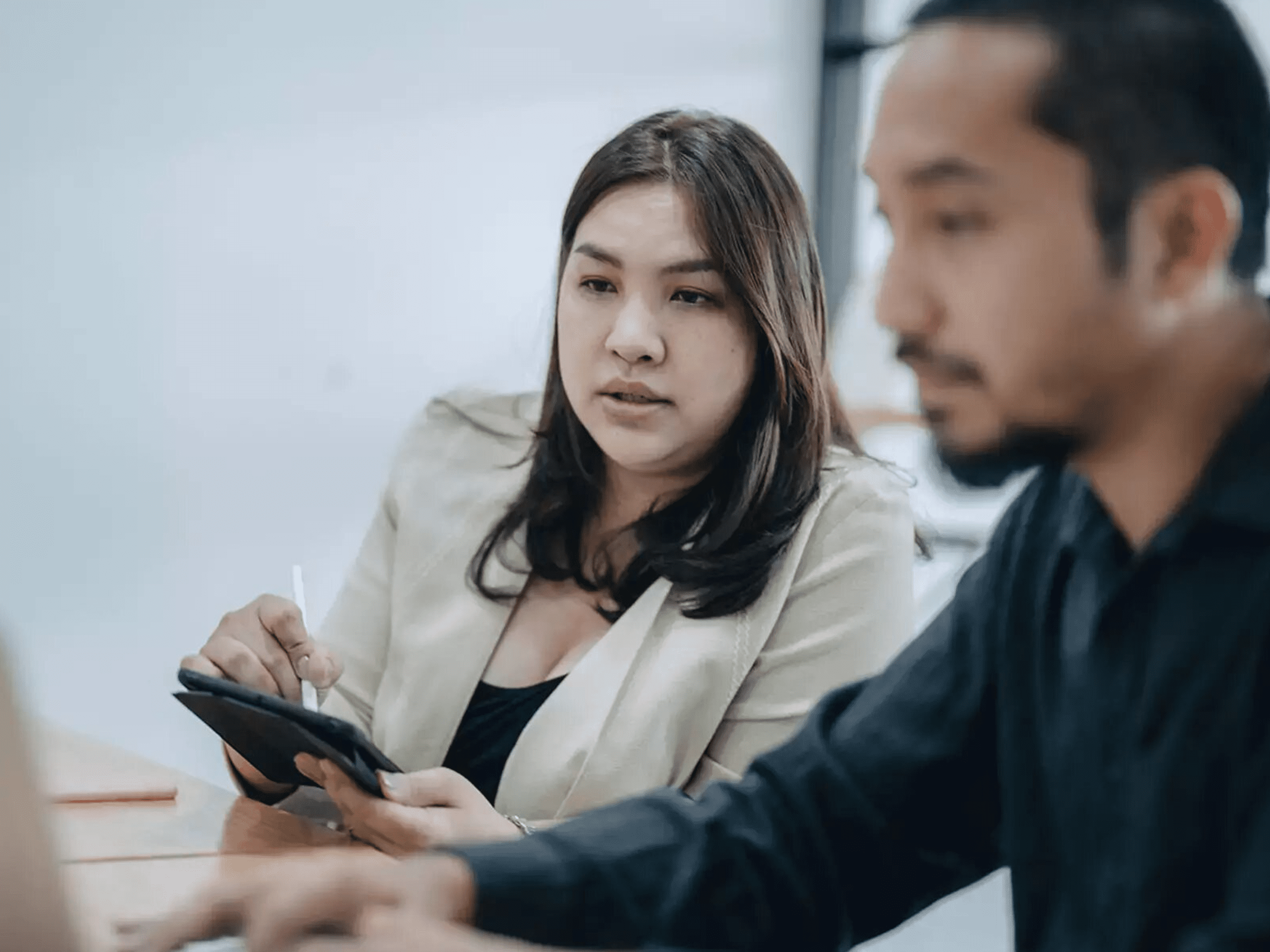 Asian lady having discussion with client